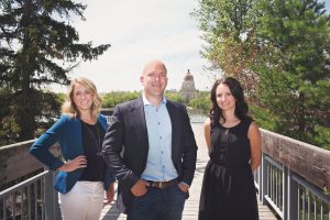 3 people standing on walkway